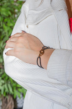 Bracelet DINH VAN "Menottes R12" en or rose sur cordon - Castafiore