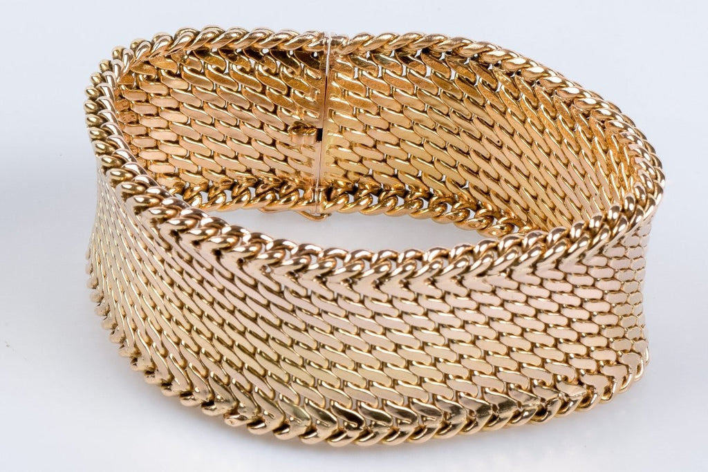 Bracelet en or jaune 18 carats en maille serpentine avec fermoir cliquet. - Castafiore