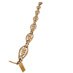 Bracelet en or jaune à maillons à décor de feuillages - Castafiore