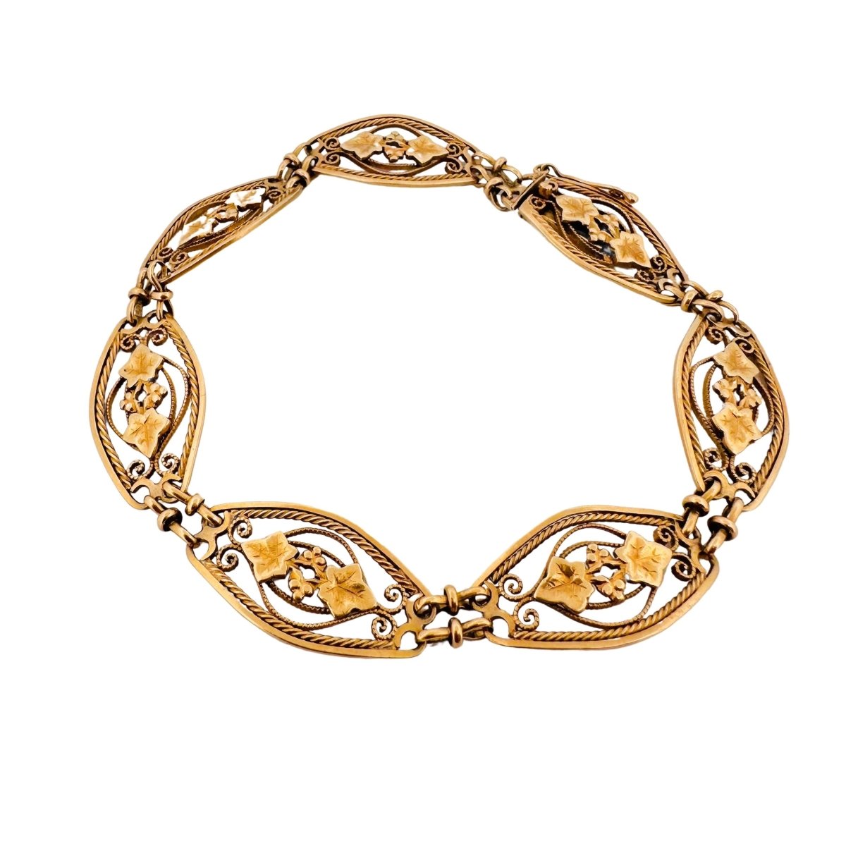 Bracelet en or jaune à maillons à décor de feuillages - Castafiore