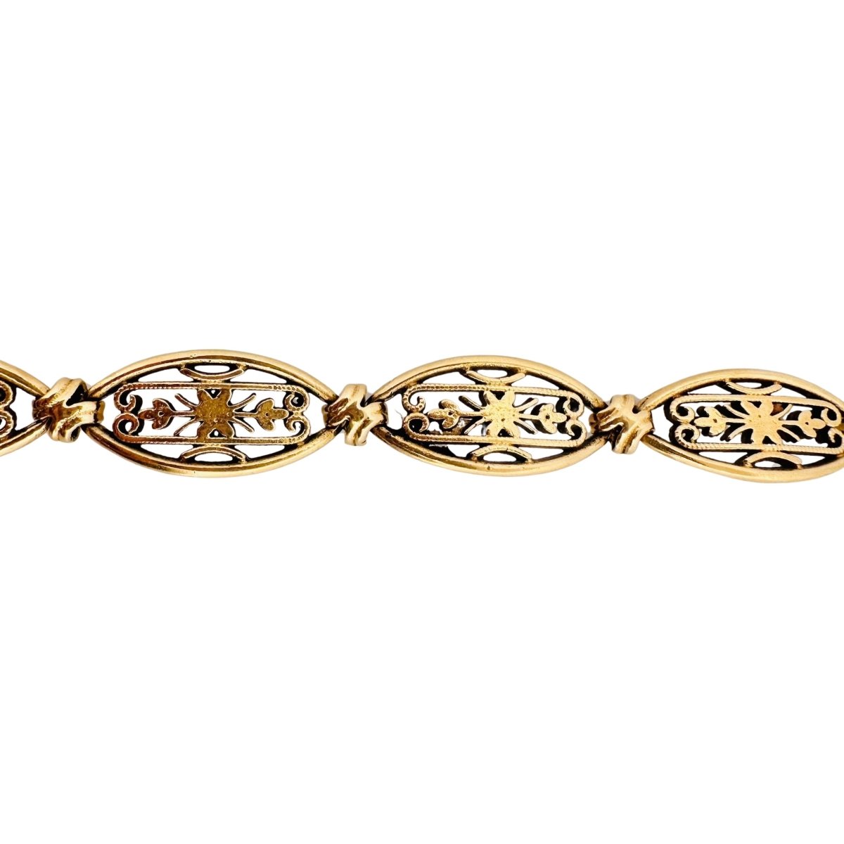 Bracelet en or jaune avec maillons ovales à décor de formes géométriques - Castafiore
