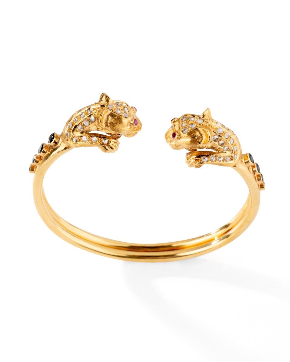 Bracelet Jonc LALAOUNIS en or jaune à deux têtes de lion - Castafiore