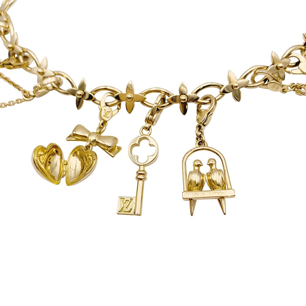 Bracelet Louis Vuitton, "Idylle", breloques, or jaune, or blanc, perles. - Castafiore