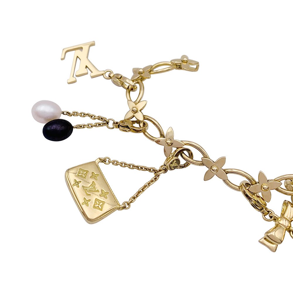 Bracelet Louis Vuitton, "Idylle", breloques, or jaune, or blanc, perles. - Castafiore