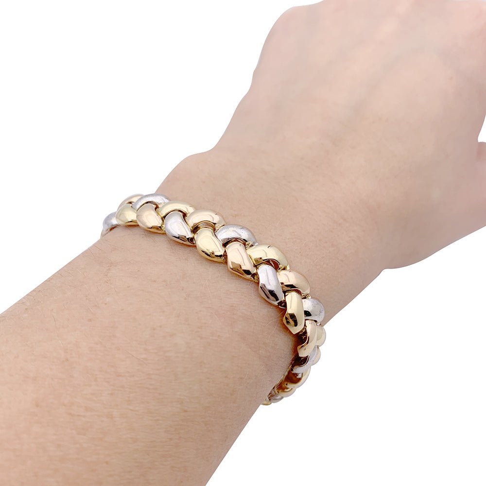 Bracelet Poiray, "Tresse", trois tons d'or. - Castafiore
