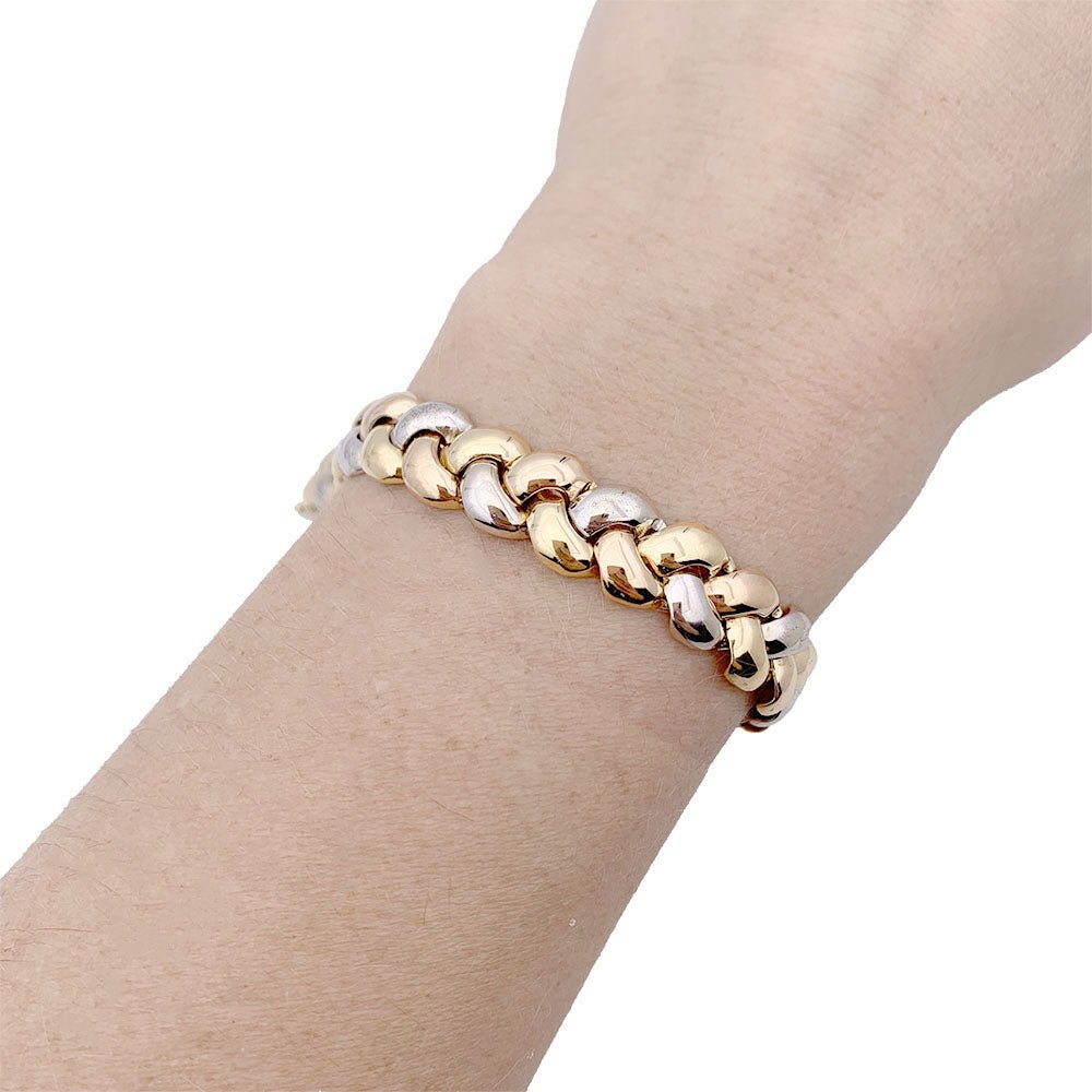 Bracelet Poiray, "Tresse", trois tons d'or. - Castafiore