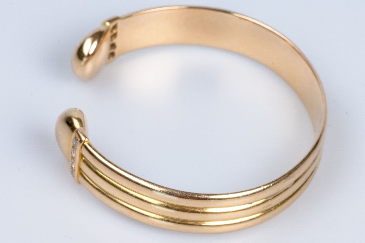 Bracelet rigide en or jaune 18 carats orné de 8 diamants ronds brillats de 0,20 carats - Castafiore