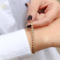 Bracelet tennis vintage en or jaune et diamants en serti clos - Castafiore