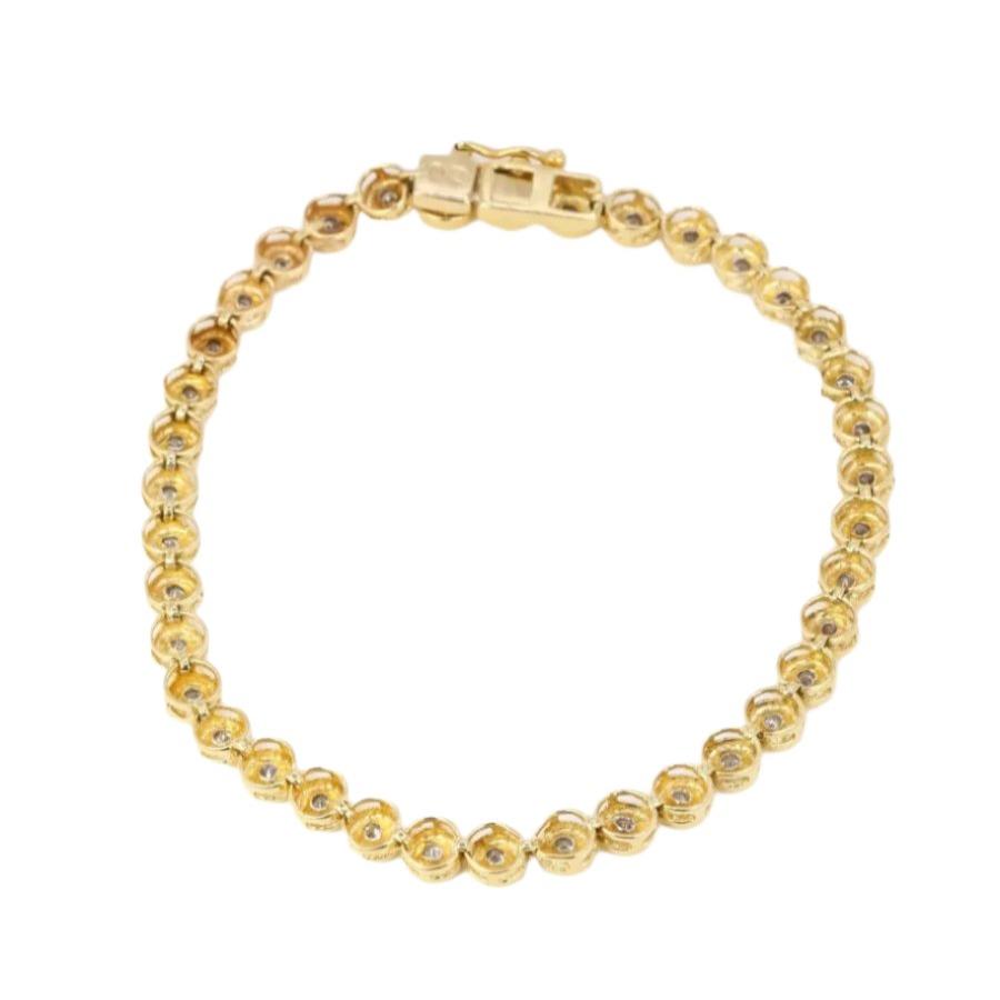Bracelet tennis vintage en or jaune et diamants en serti clos - Castafiore