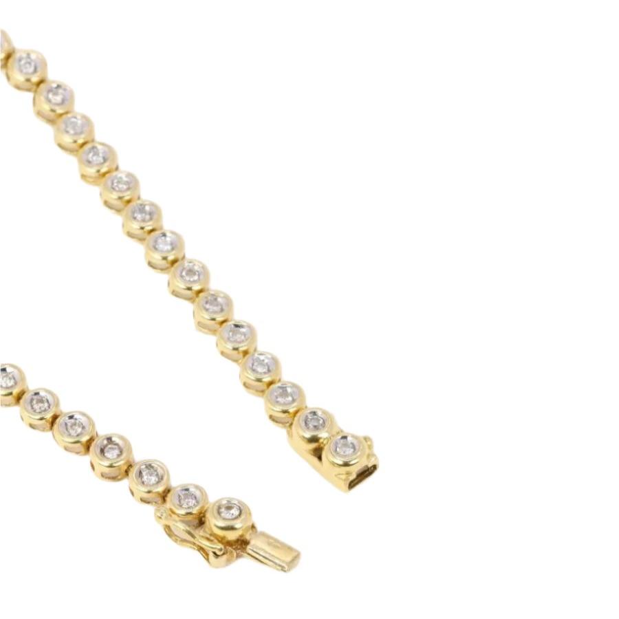 Bracelet tennis vintage en or jaune et diamants en serti clos - Castafiore