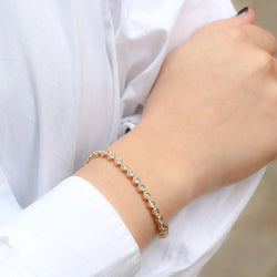 Bracelet tennis vintage en or jaune et diamants en serti clos - Castafiore