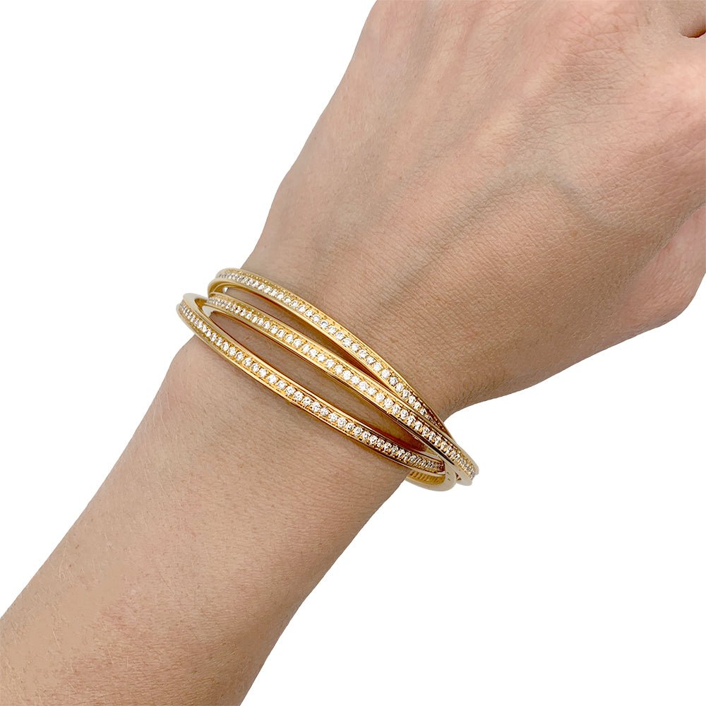 Bracelet triple joncs or jaune, diamants. - Castafiore