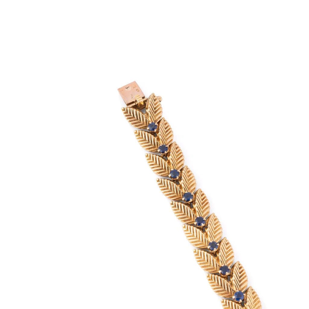 Bracelet VAN CLEEF & ARPELS feuilles en or jaune et saphirs - Castafiore