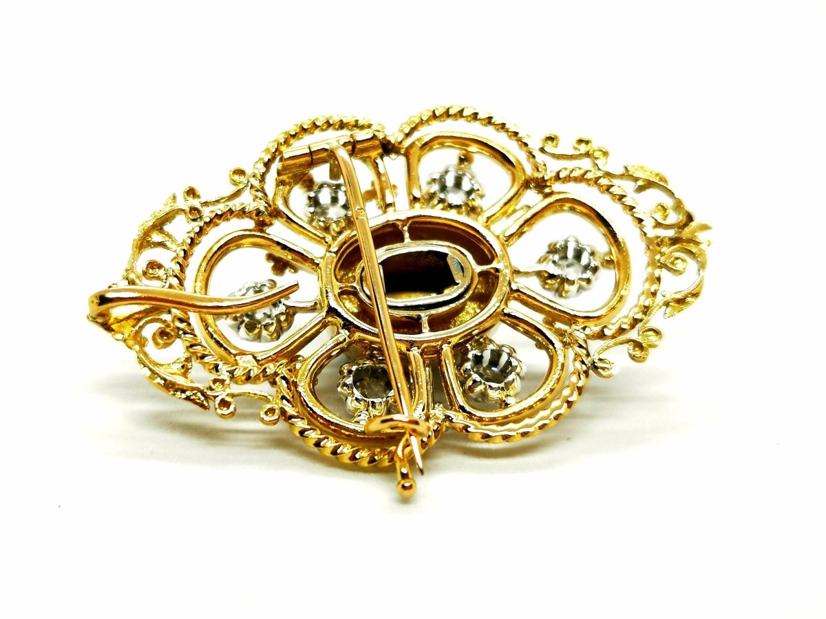 Broche Art déco en or jaune, platine, diamants et onyx - Castafiore