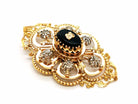 Broche Art déco en or jaune, platine, diamants et onyx - Castafiore