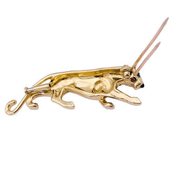 Broche Cartier, "Samantha", or jaune, émeraude et onyx. - Castafiore