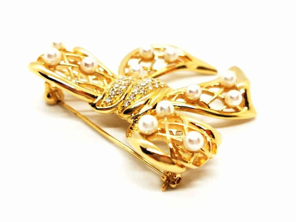 Broche noeud en or jaune, diamants et perles - Castafiore
