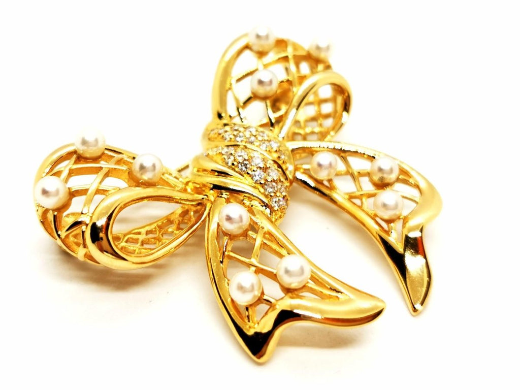 Broche noeud en or jaune, diamants et perles - Castafiore