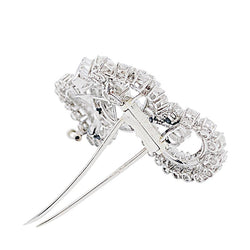 Clip J.Lacloche, "Volutes", platine, or blanc, diamants - Castafiore