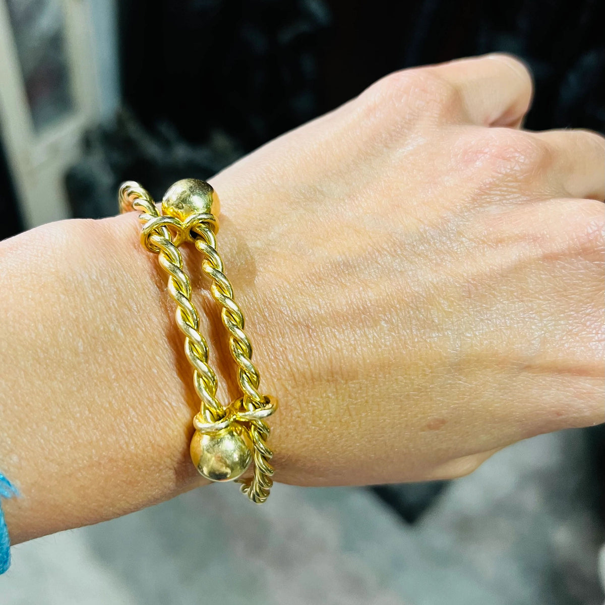 Twisted yellow gold bangle bracelet