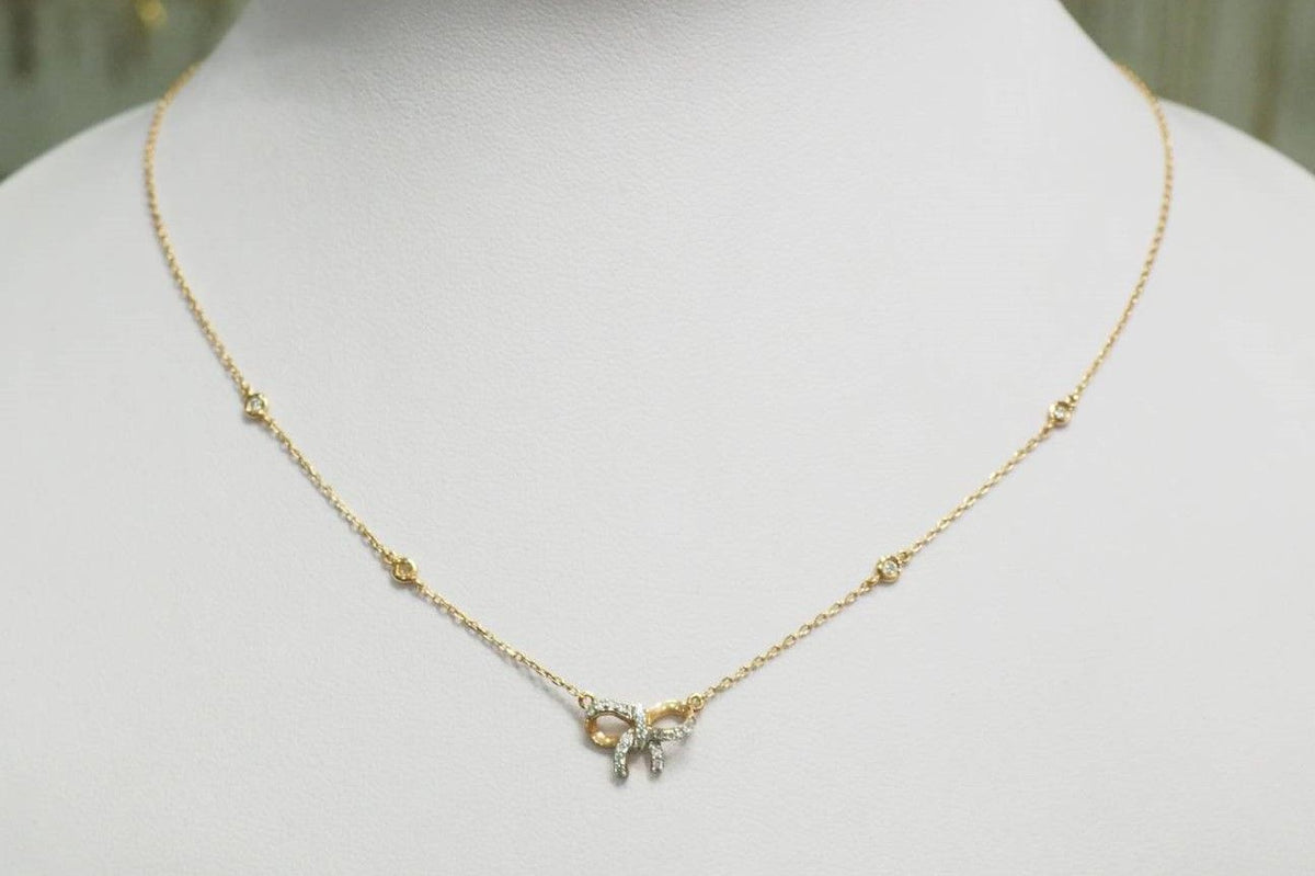 Necklace with bow motif in rose gold and diamonds 
