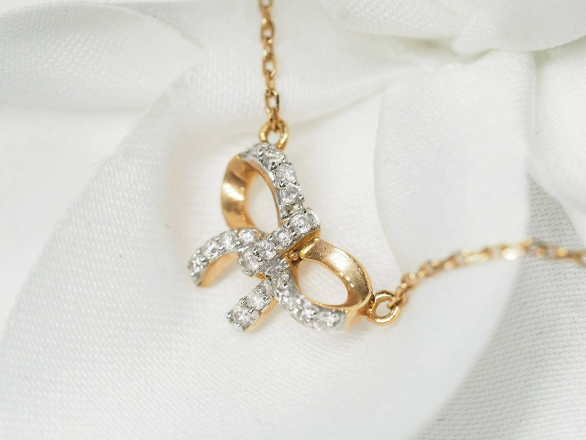 Necklace with bow motif in rose gold and diamonds 