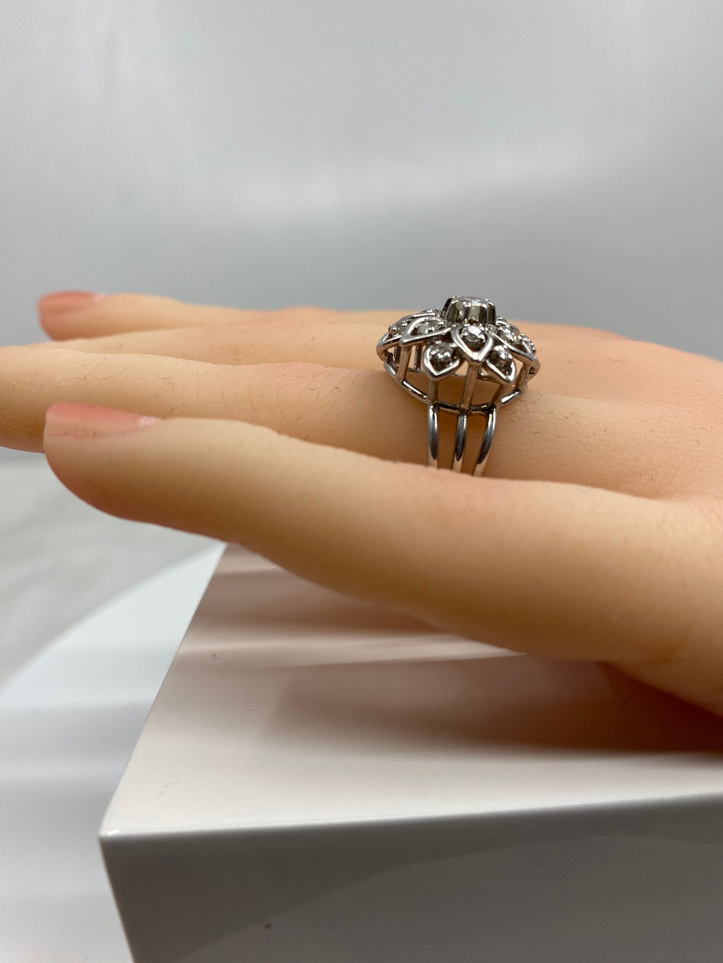 Platinum daisy ring set with diamonds