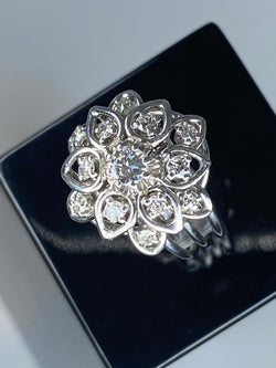 Platinum daisy ring set with diamonds
