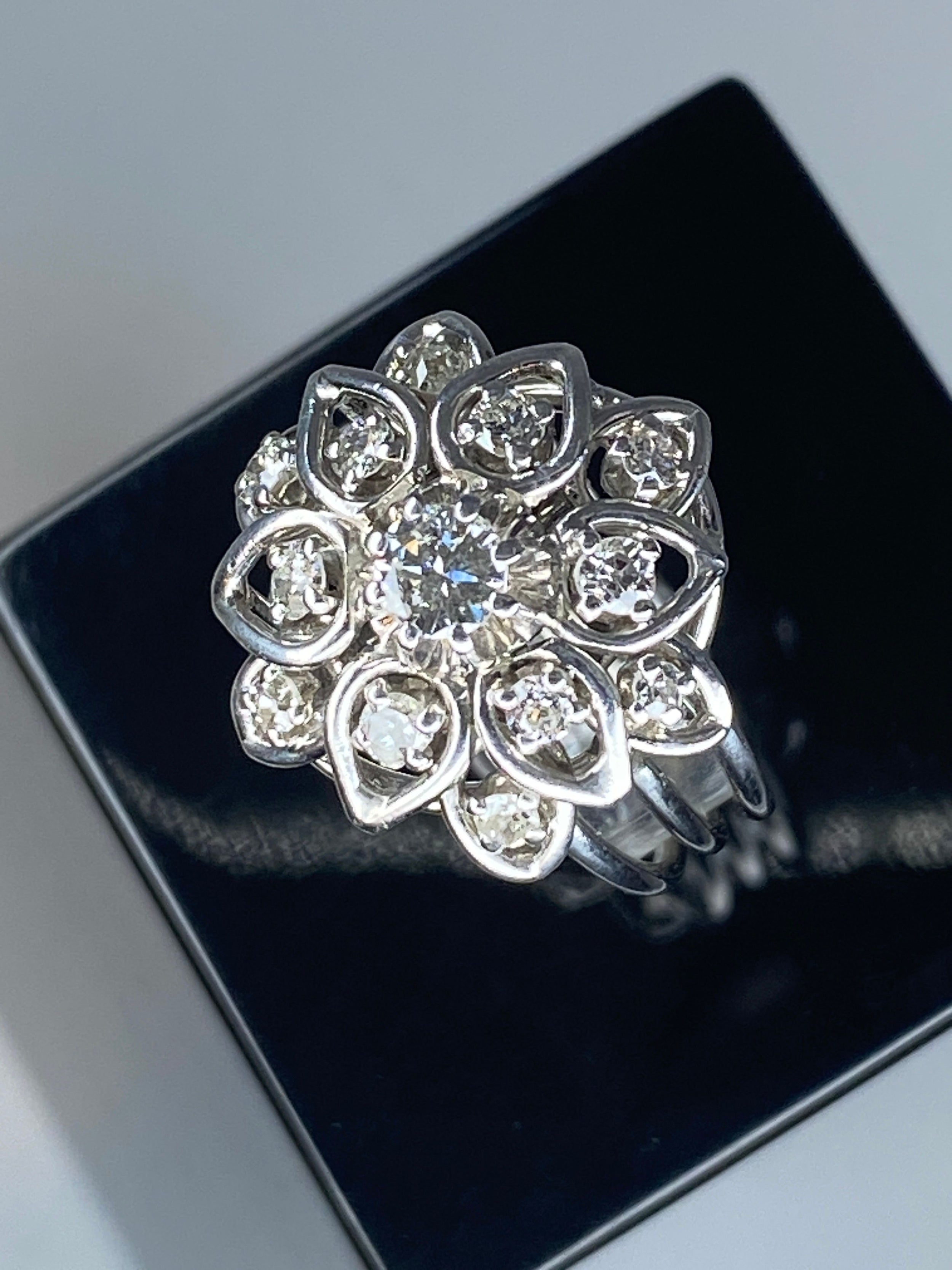 Platinum daisy ring set with diamonds