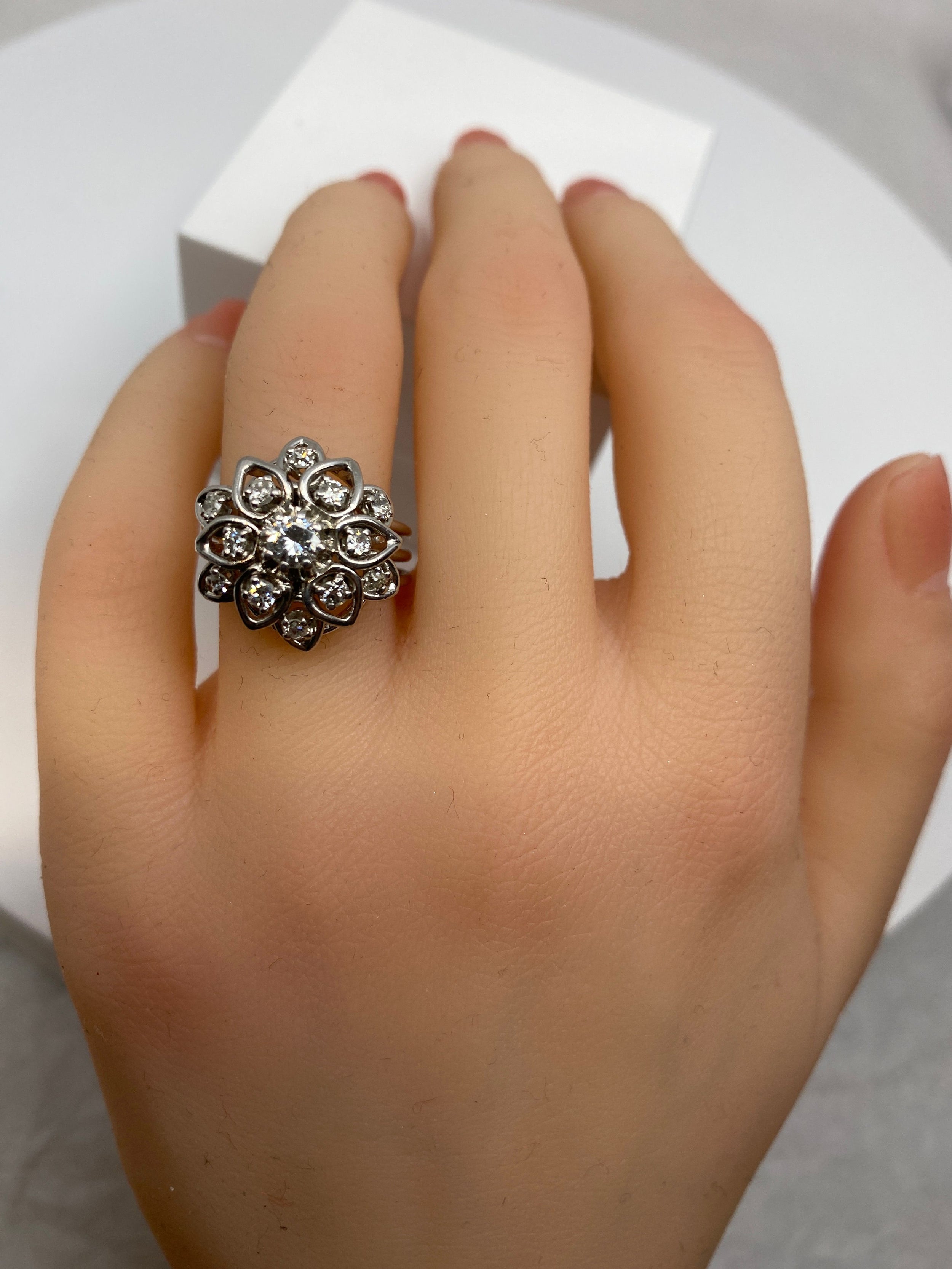 Platinum daisy ring set with diamonds