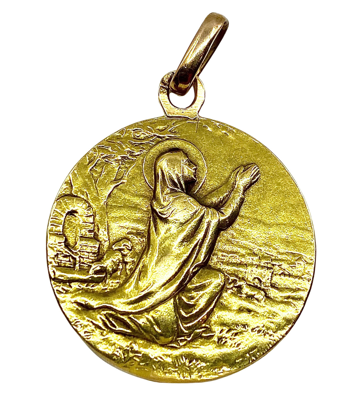 Médaille en or 18 carats représentant une sainte en prière