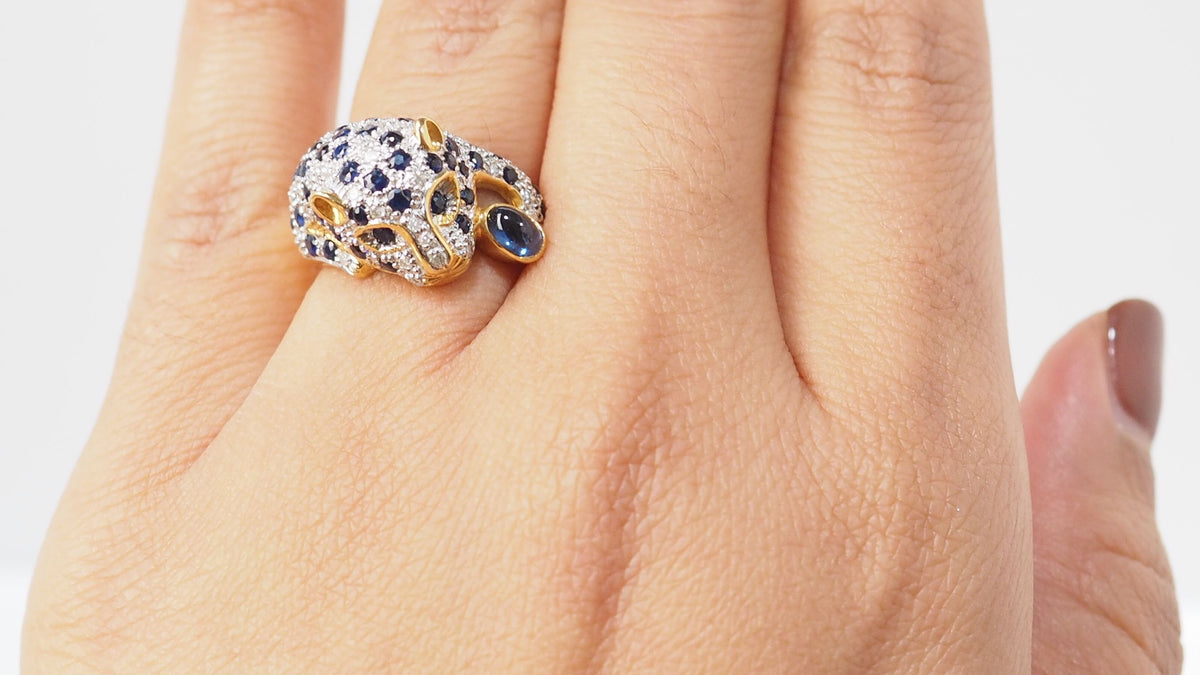 Panthère ring in yellow gold, sapphires and diamonds 