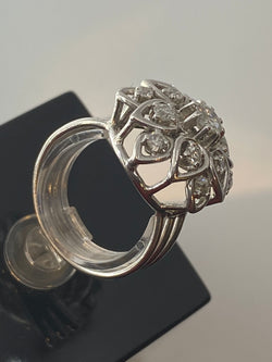 Platinum daisy ring set with diamonds