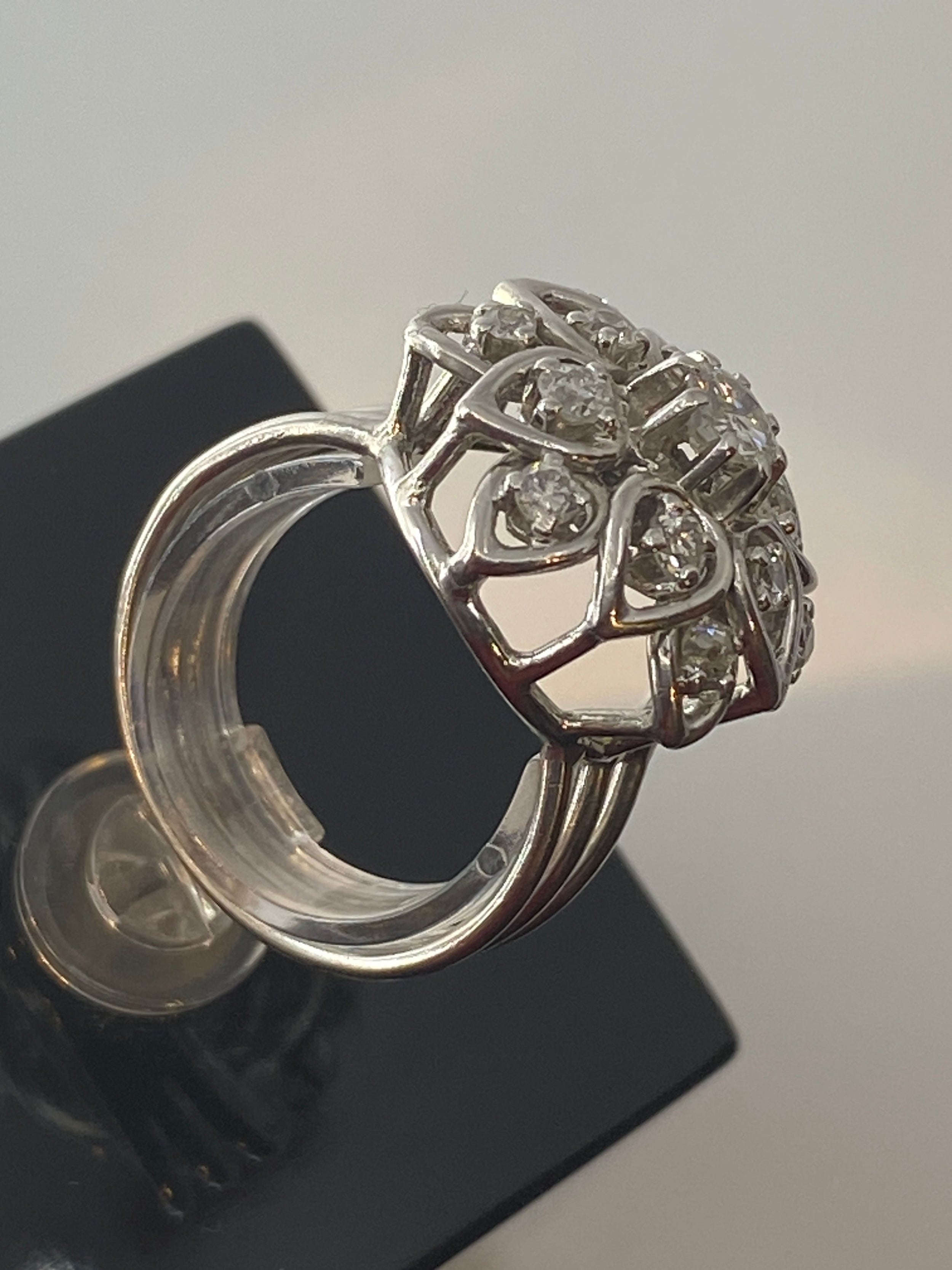 Platinum daisy ring set with diamonds