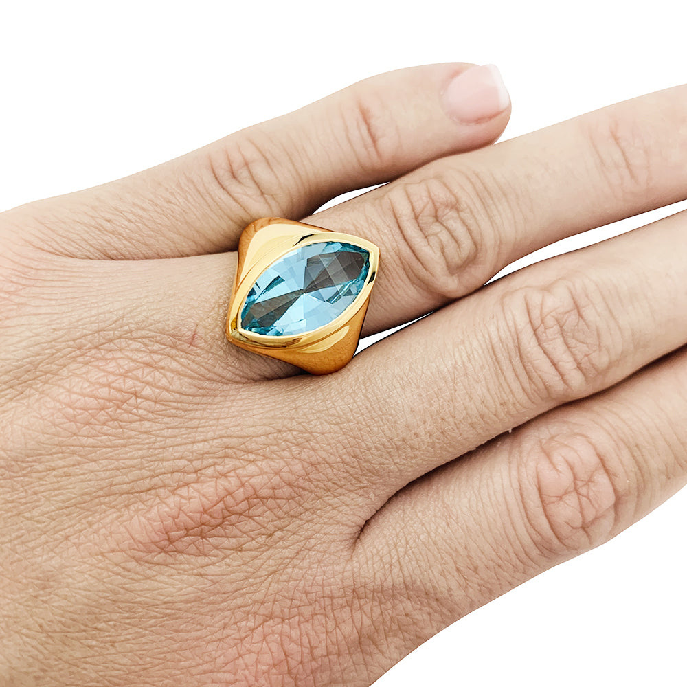Yellow gold and blue topaz ring