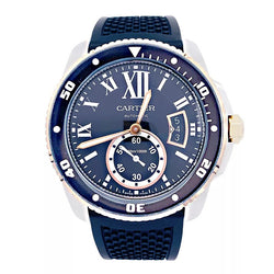 Montre Cartier Calibre en or et acier sur bracelet caoutchouc. - Castafiore