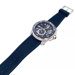 Montre Cartier Calibre en or et acier sur bracelet caoutchouc. - Castafiore