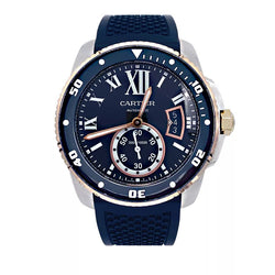 Montre Cartier Calibre en or et acier sur bracelet caoutchouc. - Castafiore