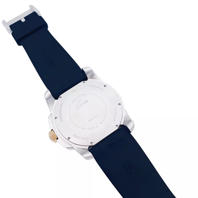 Montre Cartier Calibre en or et acier sur bracelet caoutchouc. - Castafiore