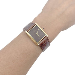 Montre CARTIER "Tank Must" argent plaqué or, cadran laqué marron. - Castafiore