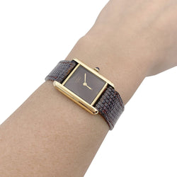 Montre Cartier "Tank Must" argent plaqué or, cadran laqué marron. - Castafiore