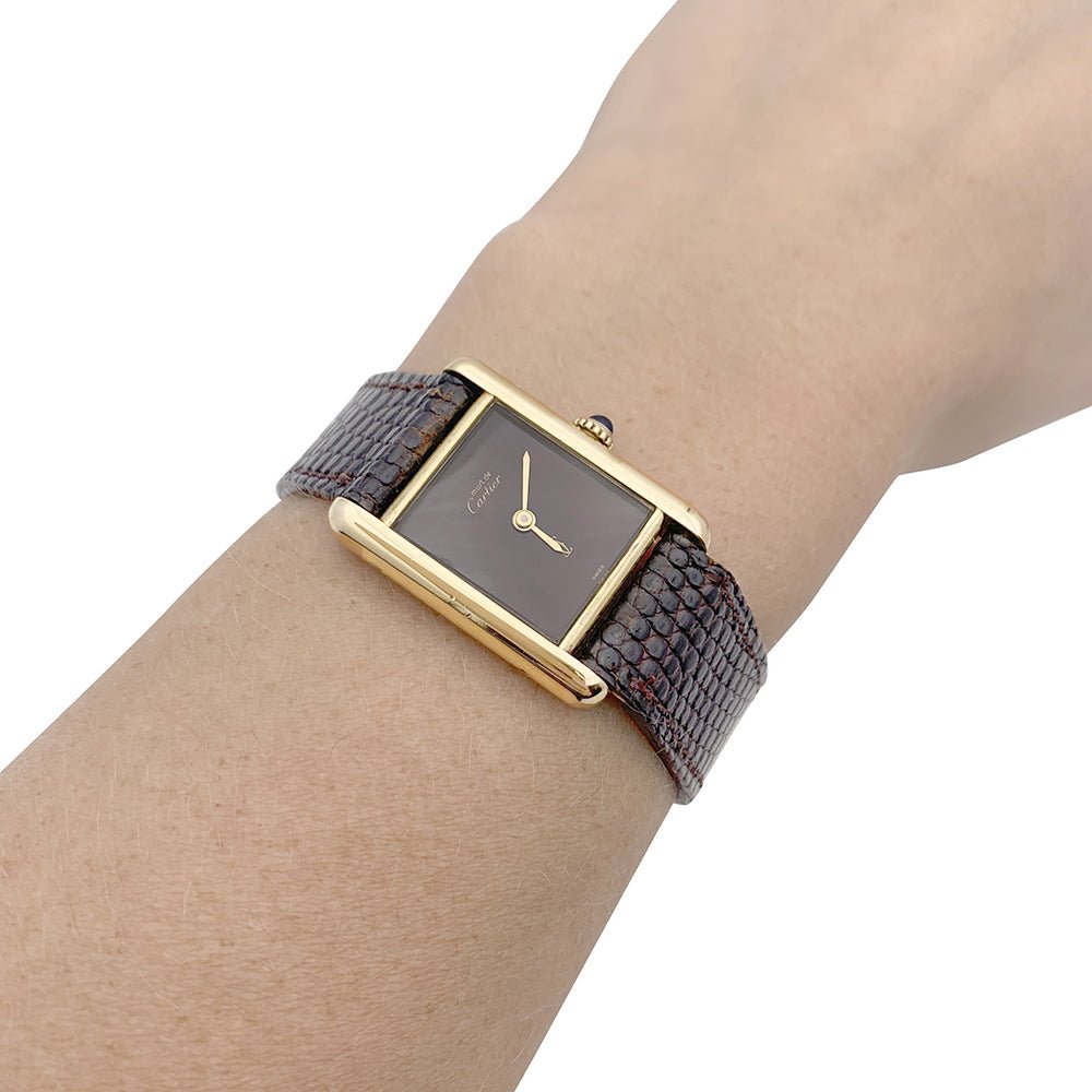 Montre Cartier "Tank Must" argent plaqué or, cadran laqué marron. - Castafiore