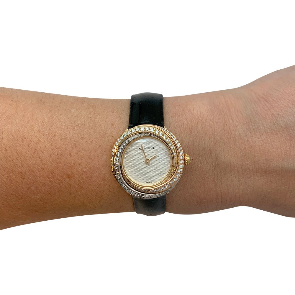 Montre Cartier "Trinity", 3 ors, diamants, cuir. - Castafiore