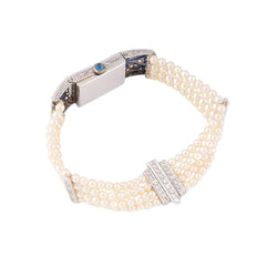 Montre de Dame Art Déco en or blanc, perles, saphirs et diamants - Castafiore
