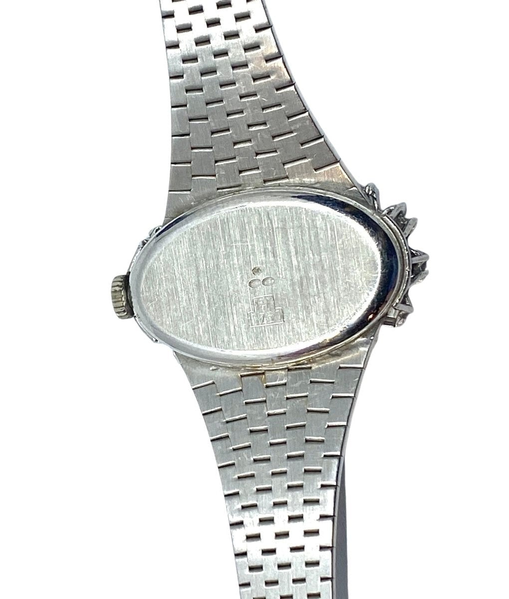 Montre de dame en or blanc et diamants ronds et baguettes. PAILLARD PARIS - Castafiore