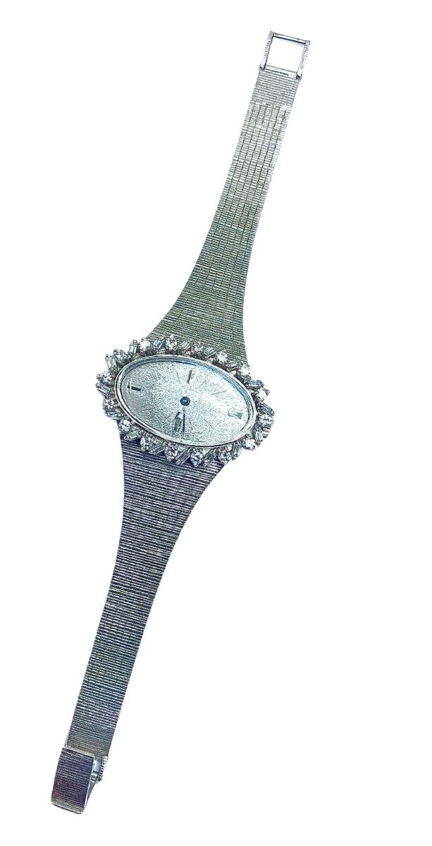 Montre de dame en or blanc et diamants ronds et baguettes. PAILLARD PARIS - Castafiore