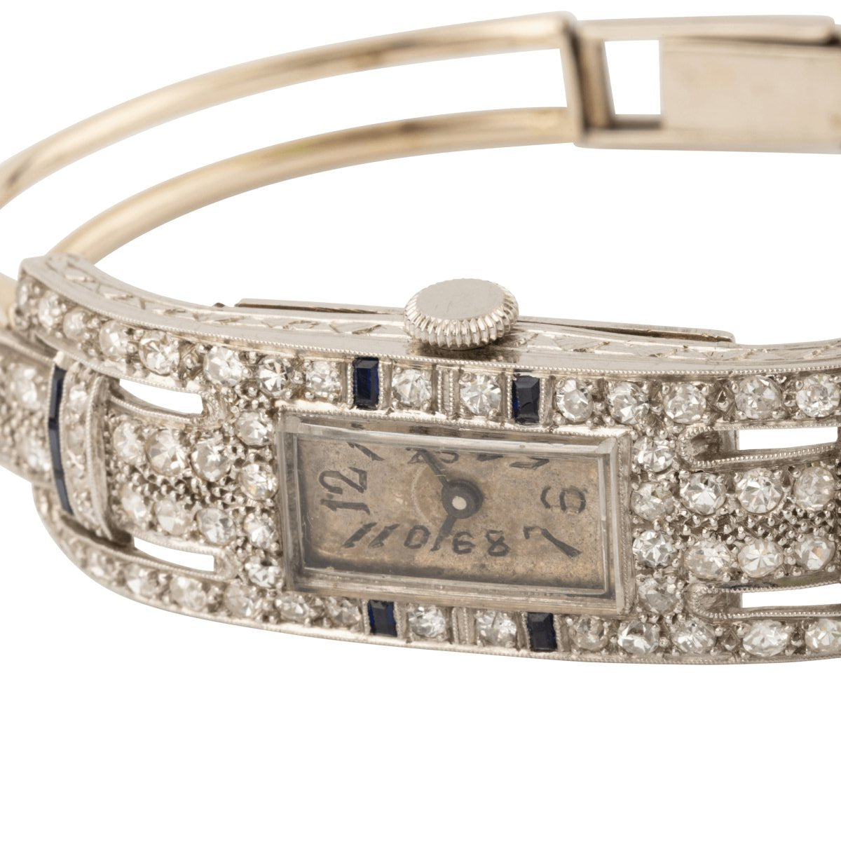 Montre de dame fine en or blanc, platine, brillants et onyx