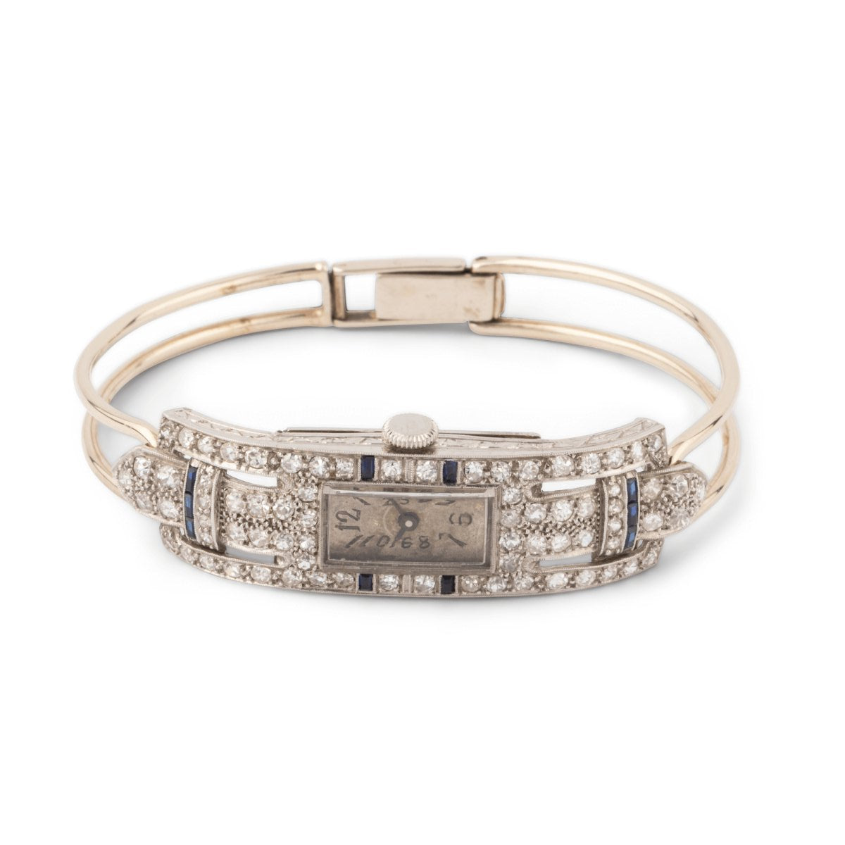 Montre de dame fine en or blanc, platine, brillants et onyx