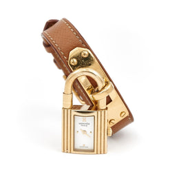 Montre HERMÈS "Kelly" plaqué or et cuir marron - Castafiore