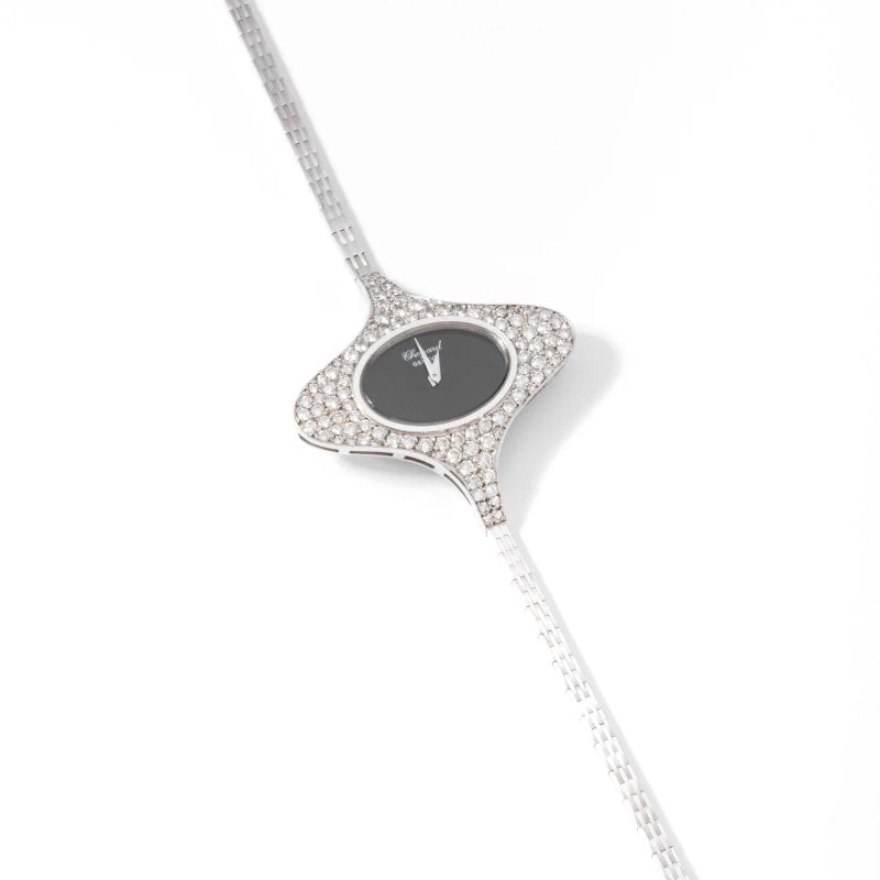 Montre ovale CHOPARD en or gris et diamants - Castafiore